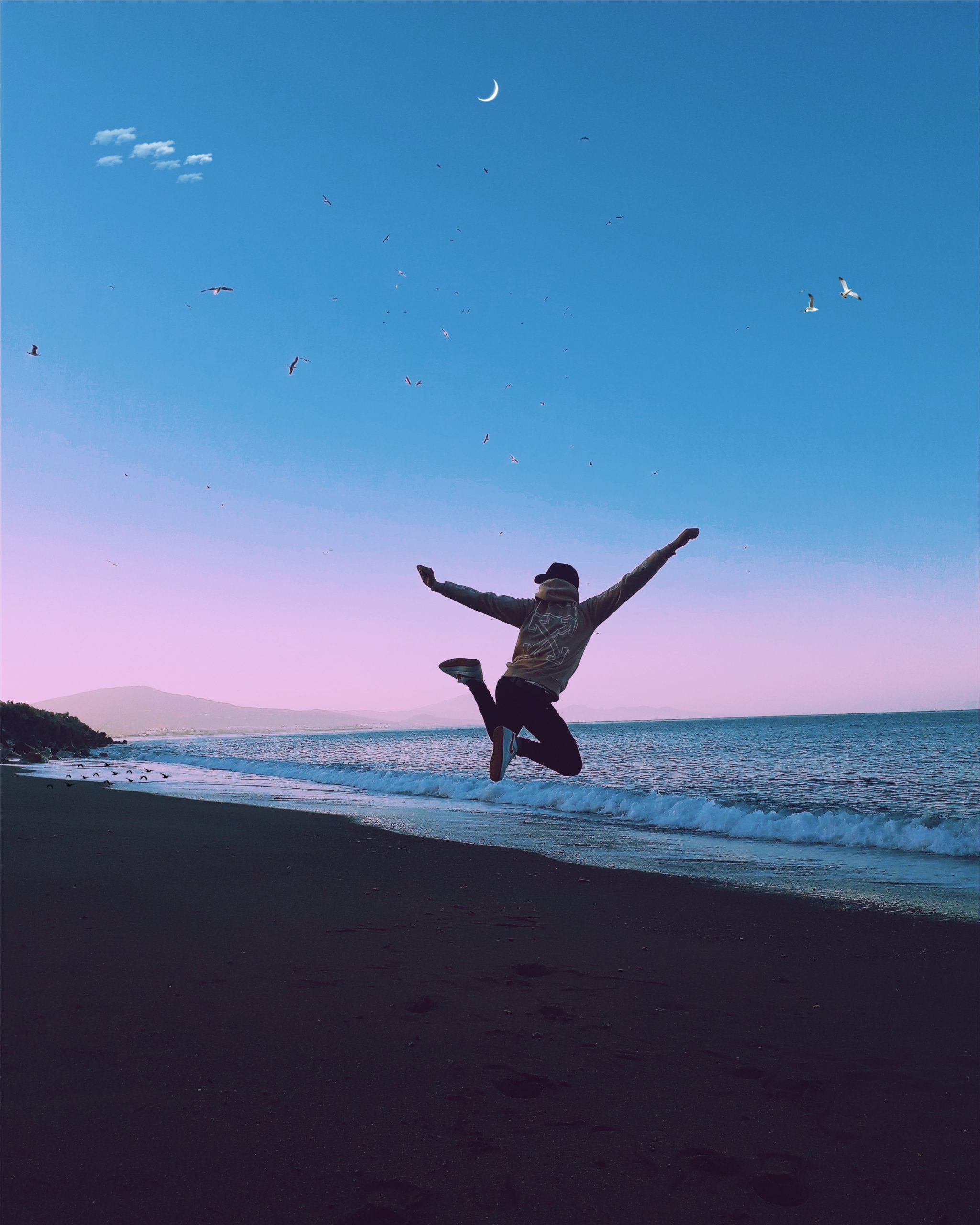 man-jumping-during-sunset-on-a-beach-2041832